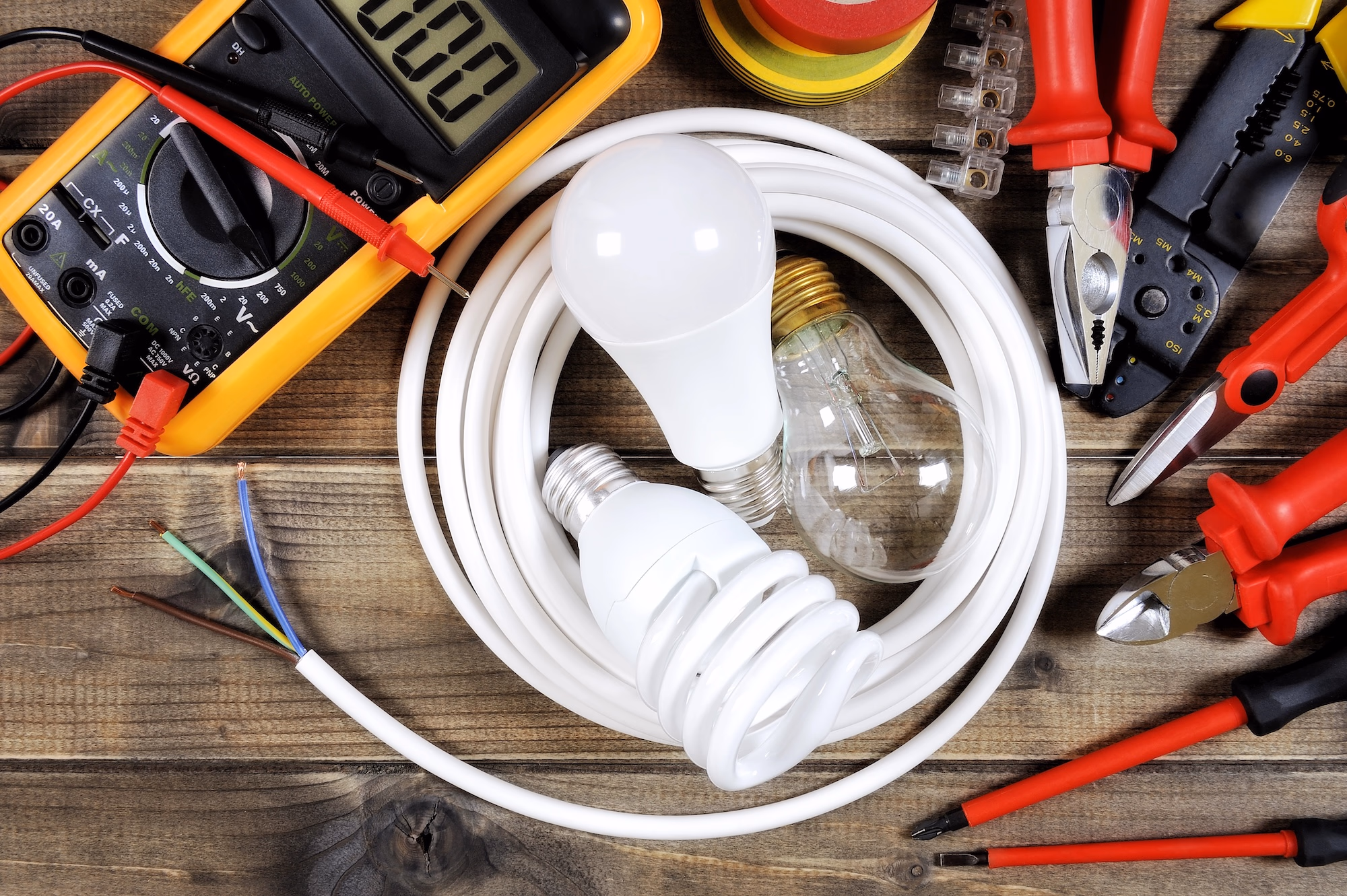 Electrical tools and equipment laid out on a work surface